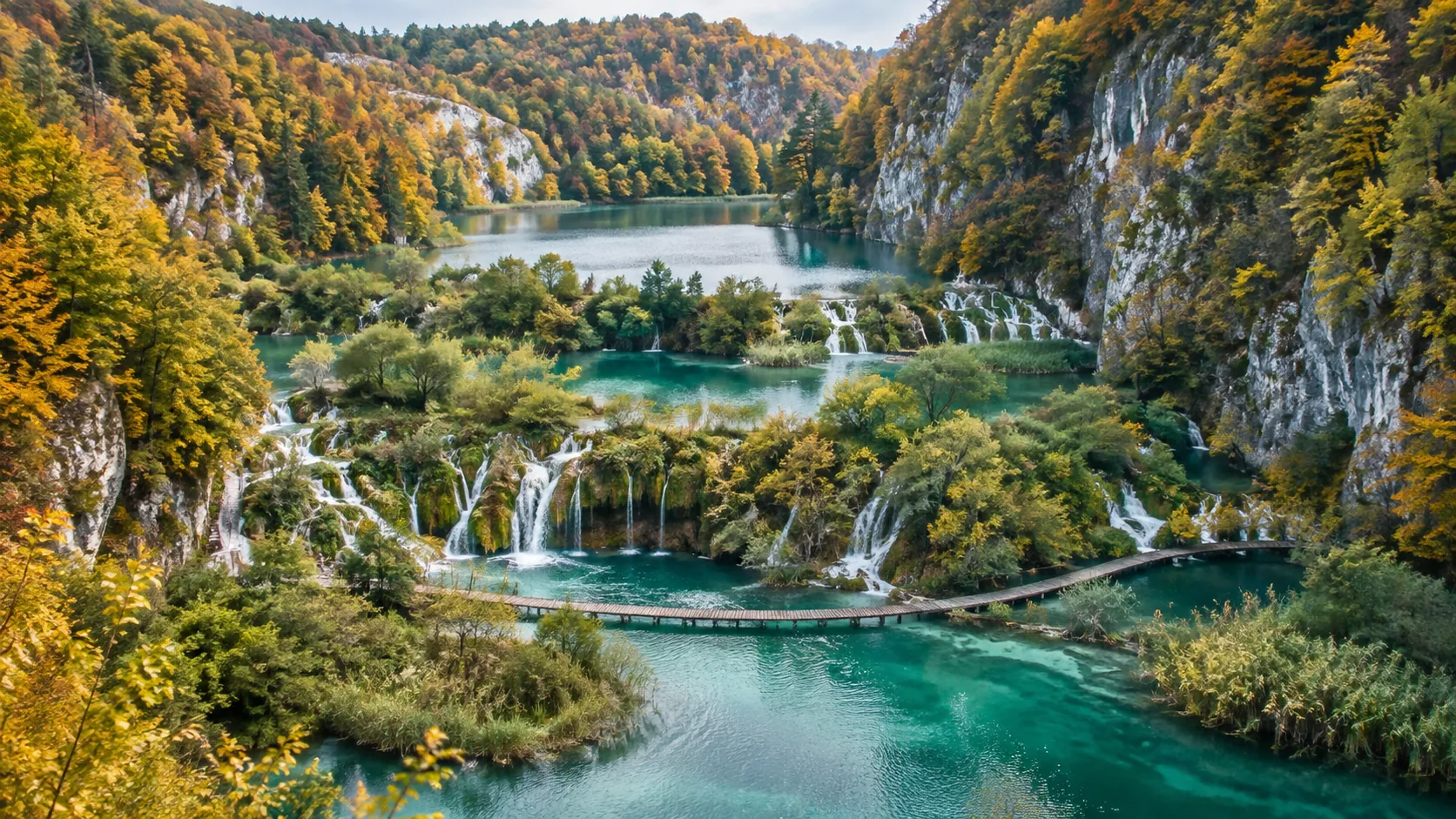 Plitvice Lakes surrounded by autumn foliage in Croatia